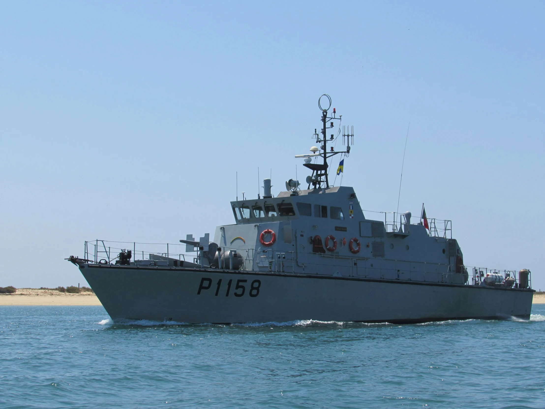 a military boat is moving through the ocean