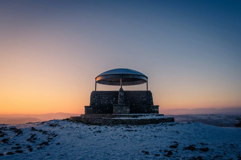 two observatorys sitting on top of a snow covered hill