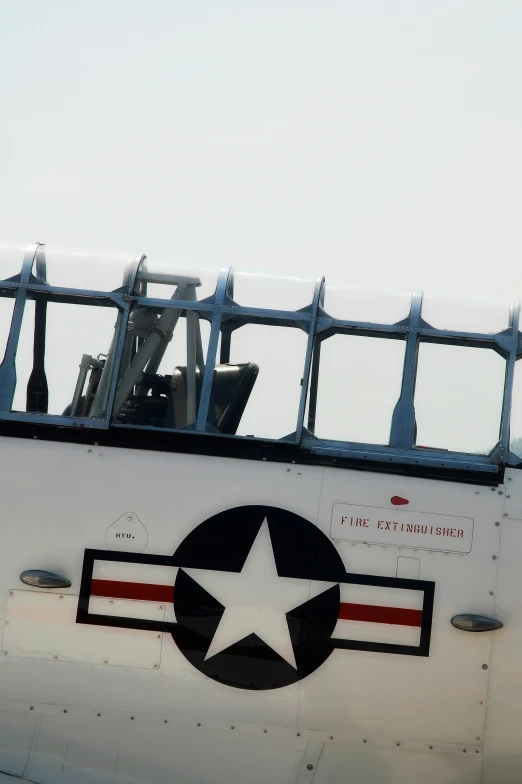 the back window of an old plane with a star on it