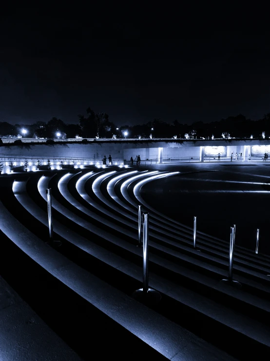 a couple of benches that are near some grass