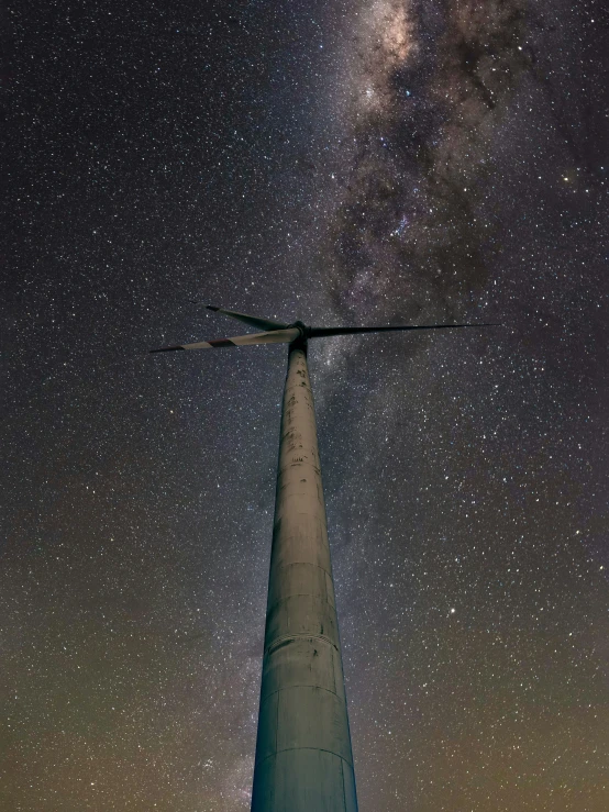 the sky over a building with a star field below it