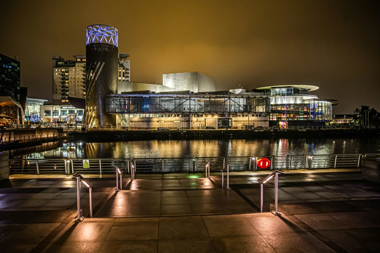 a city night with city lights and some lights near the water