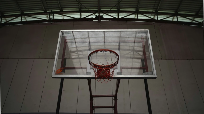 a basketball hoop that is attached to the outside of a wall