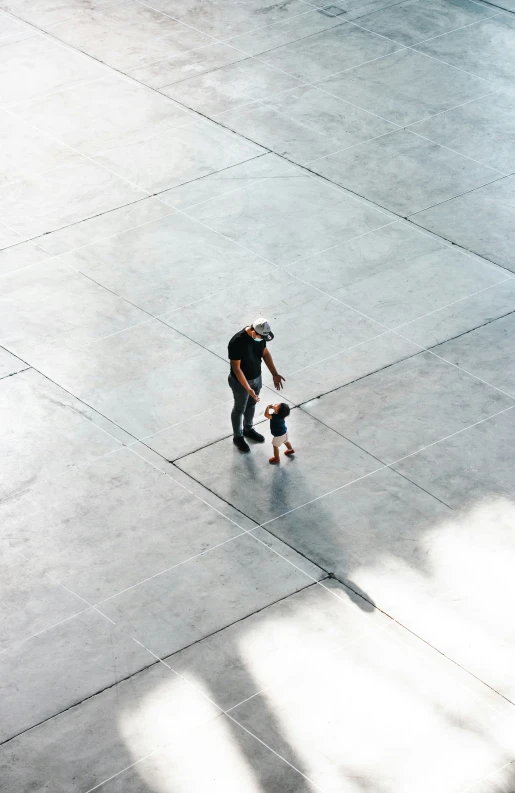 a  rides his skateboard down the sidewalk