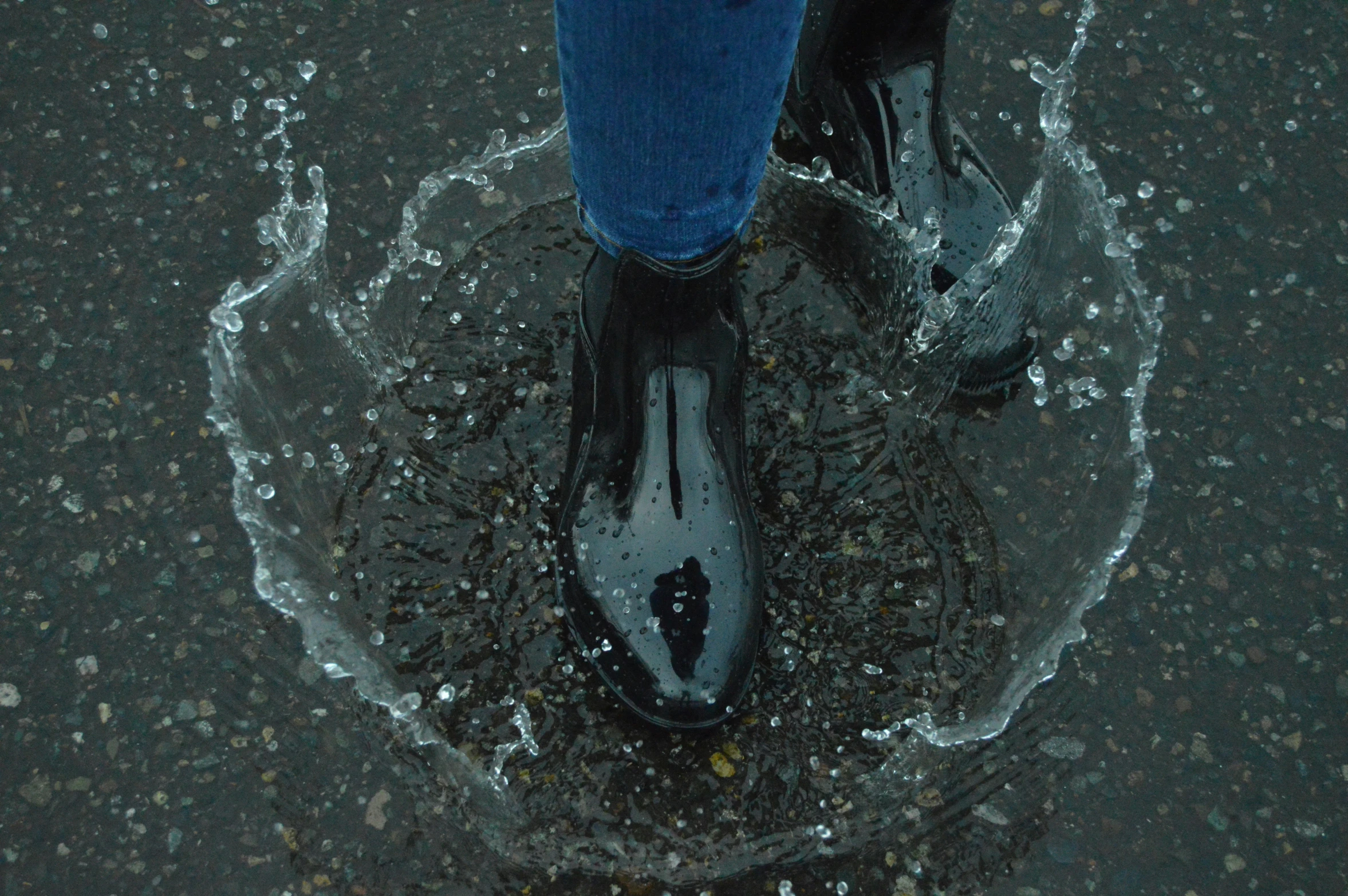 the bottom view of the boot of a person standing in water