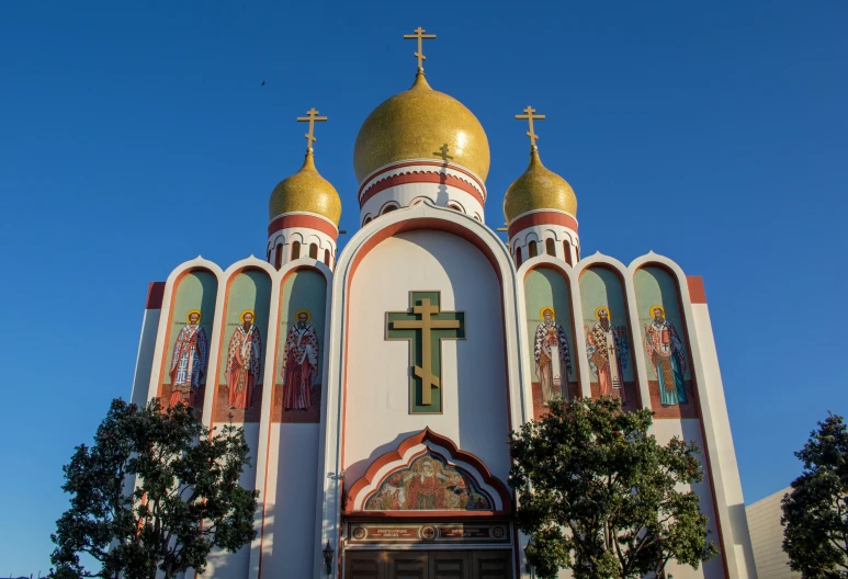 a church with three cross on it's front wall