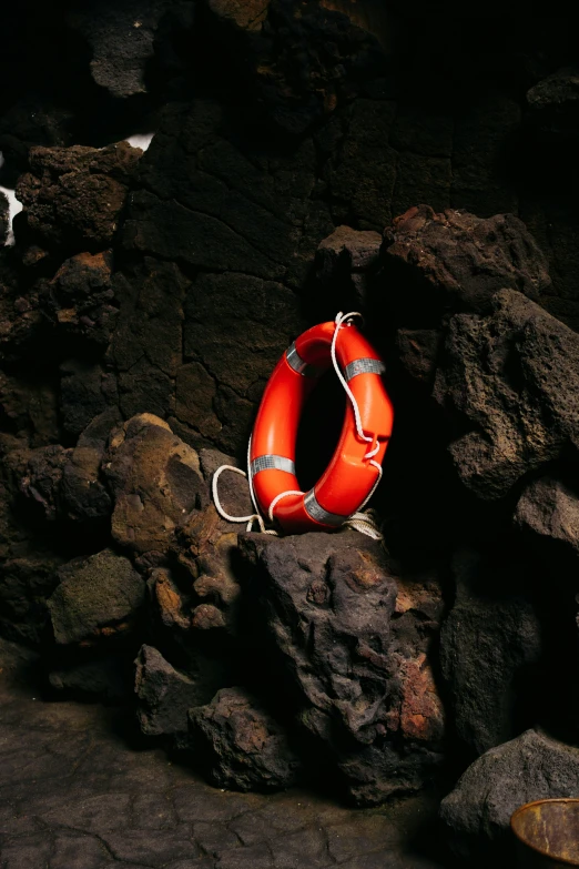 an life preserver attached to a rocky shore