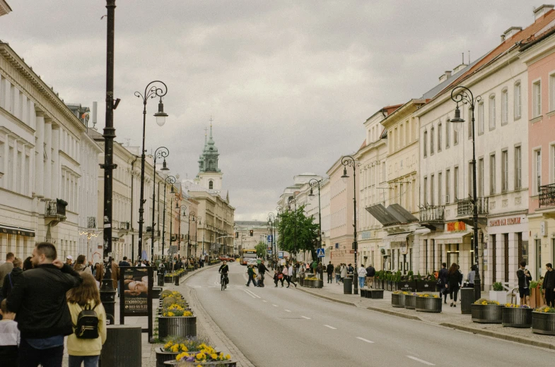 a view of a street with many pedestrians