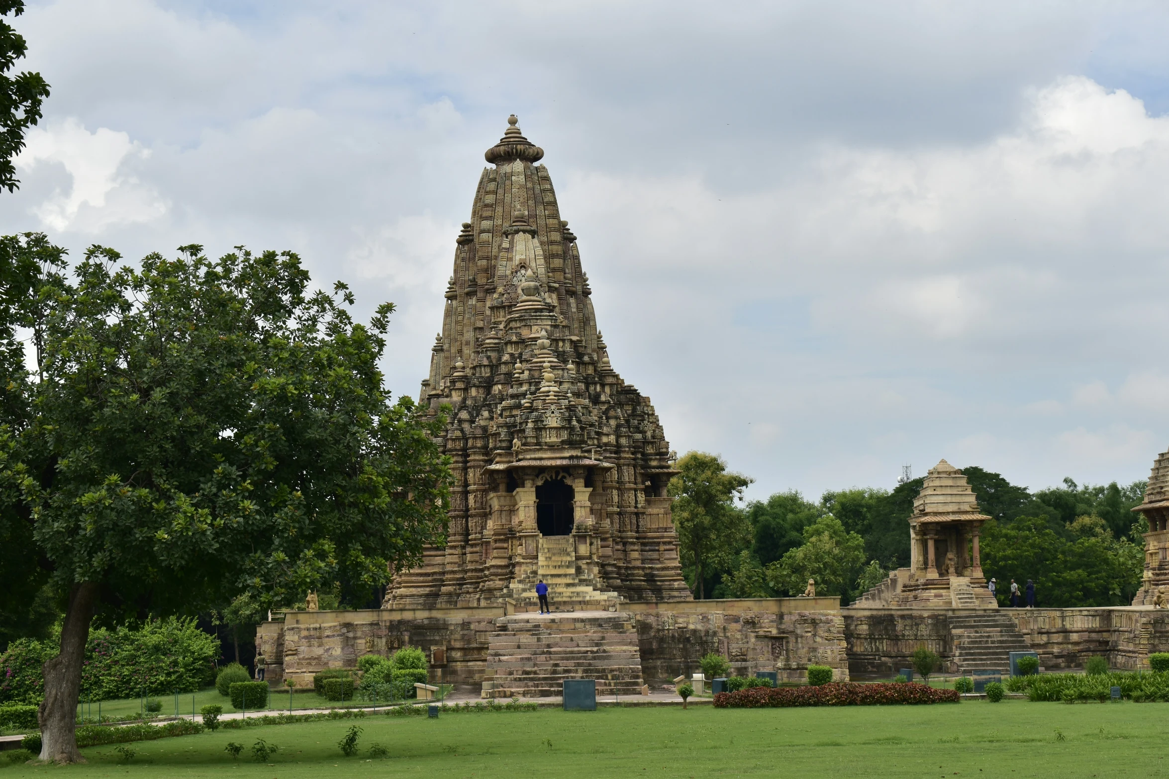 a tall tower with a cross at the top of it