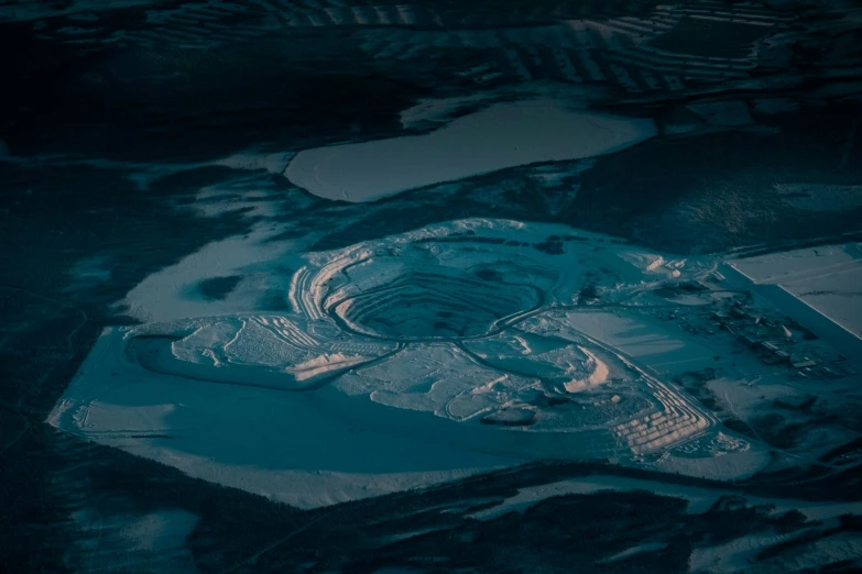 an aerial view of a frozen area in the evening