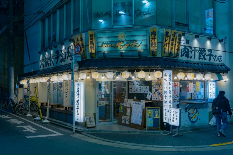 a man walking down the street in front of a store