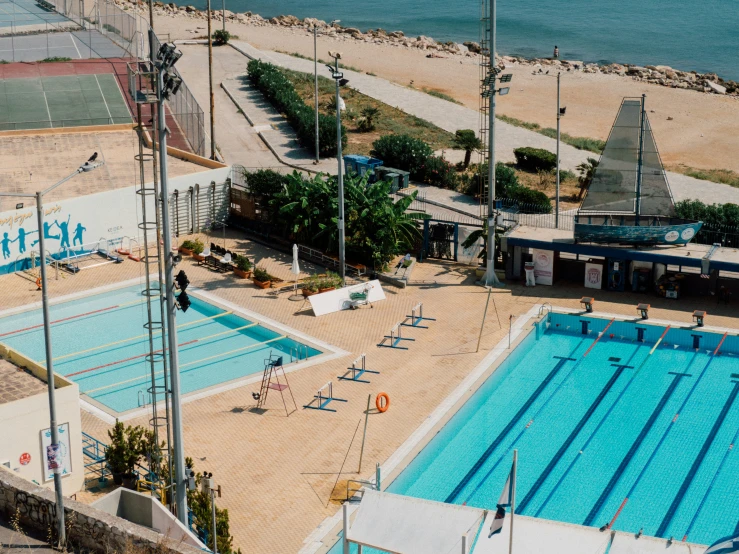 an overhead view of a pool with people at it and some water