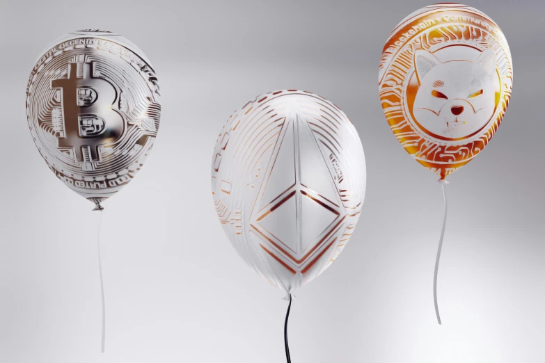 three balloons with a metallic design in the middle