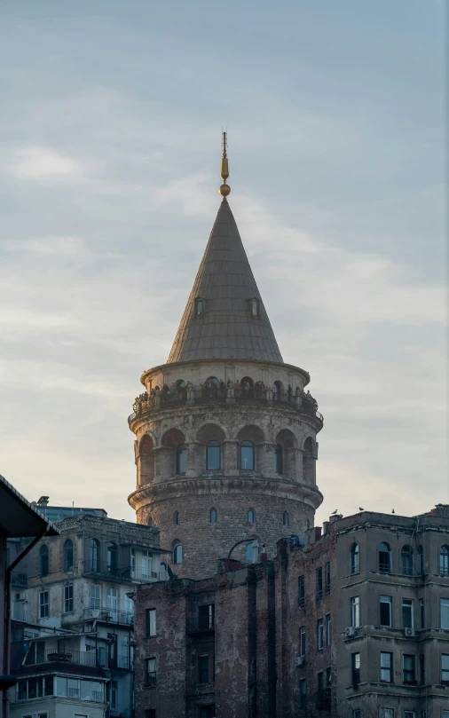 a clock tower on top of the city buildings