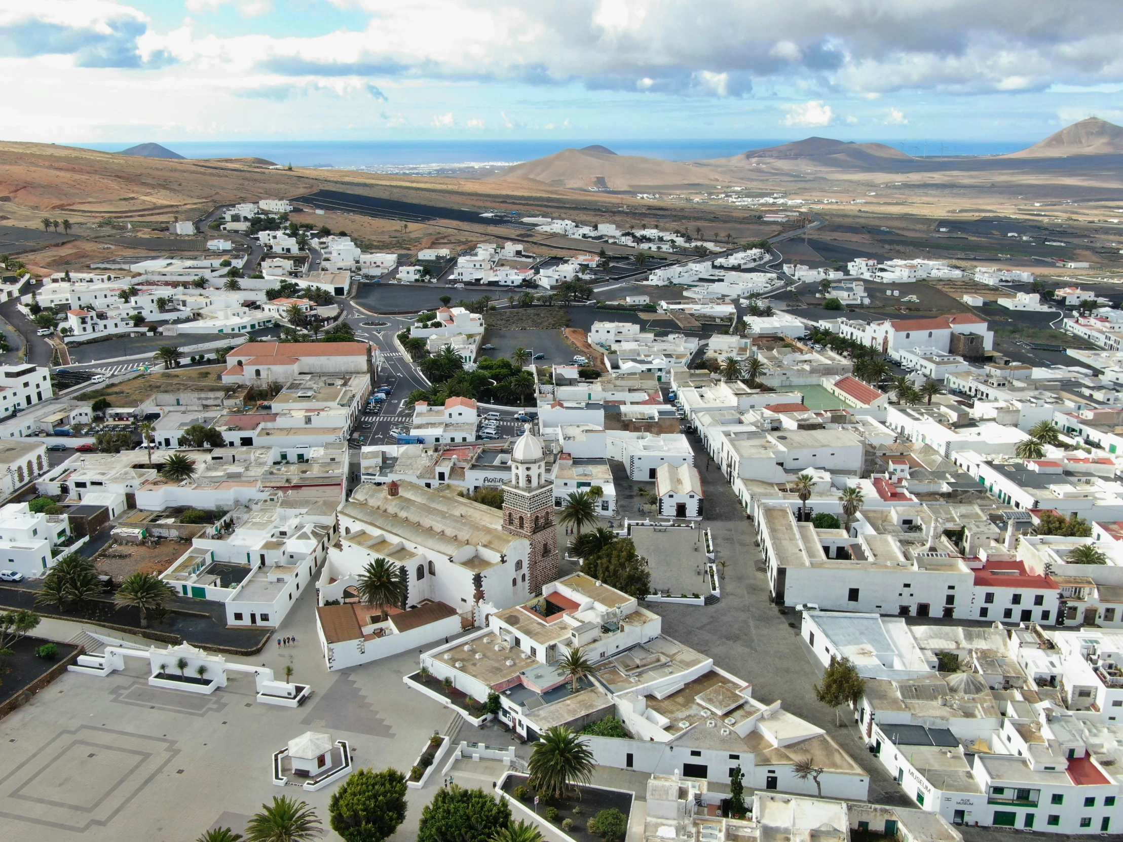 an aerial view of a city in the mountains