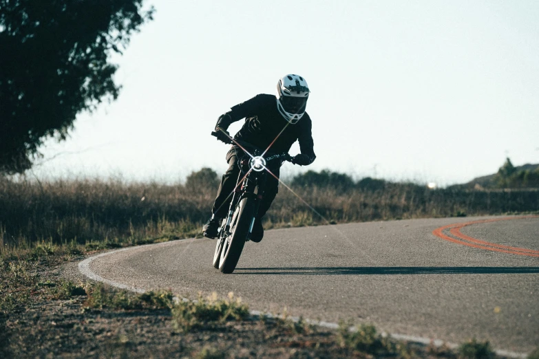 a person riding on a motorcycle in the road