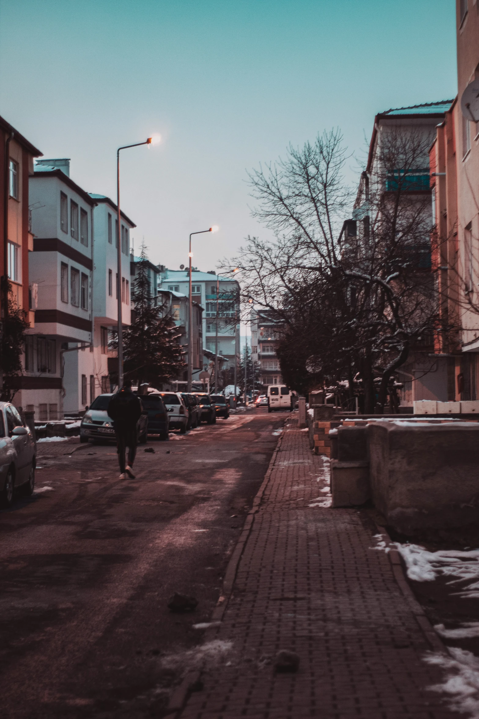 a person walks down the street in an empty town