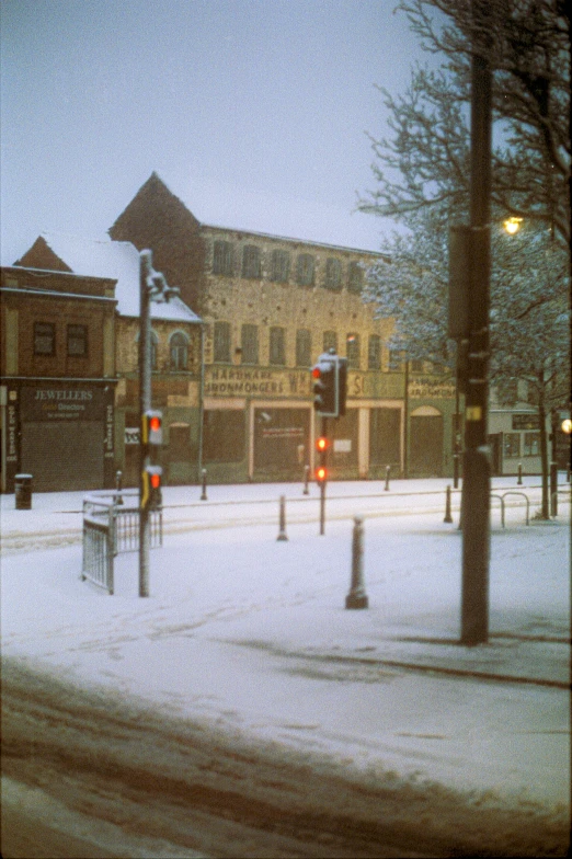 a city street at twilight, the sky is mostly dark