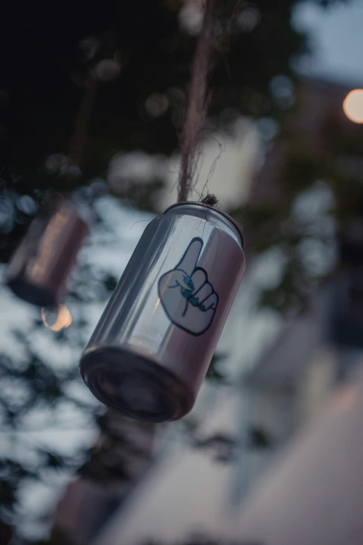 a close up of a can on the side of a building