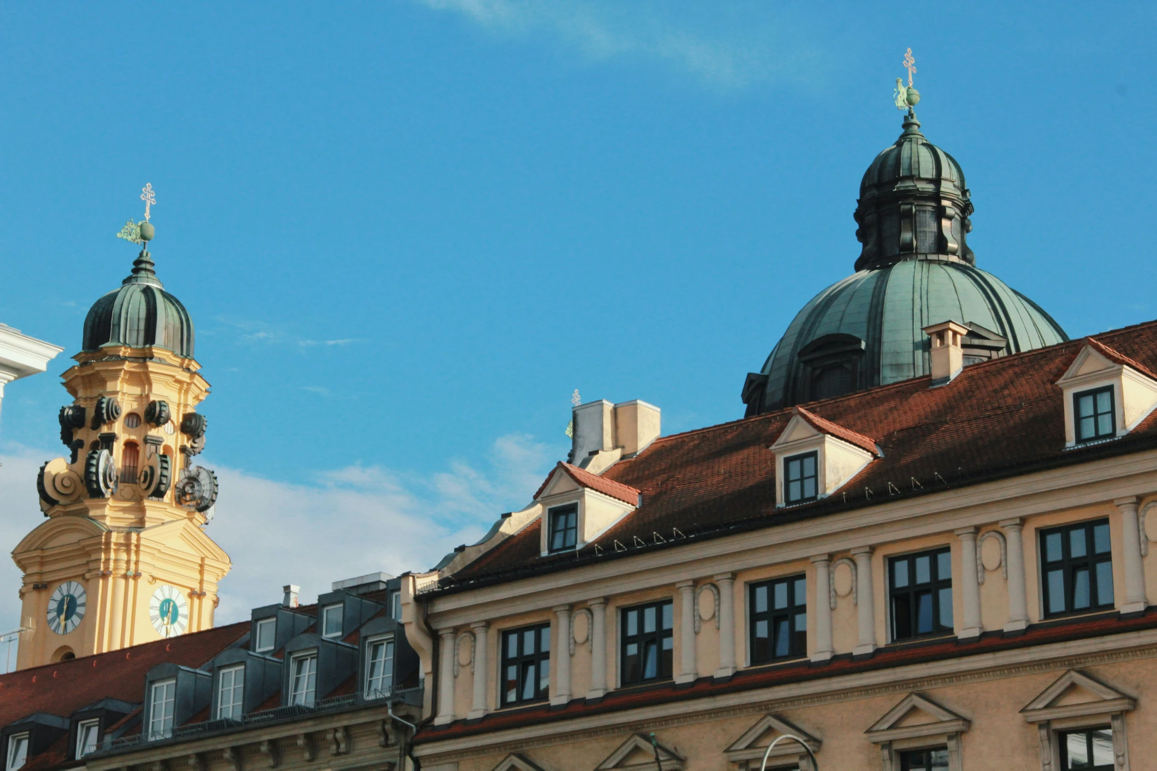 old buildings are shown in the background under the blue sky