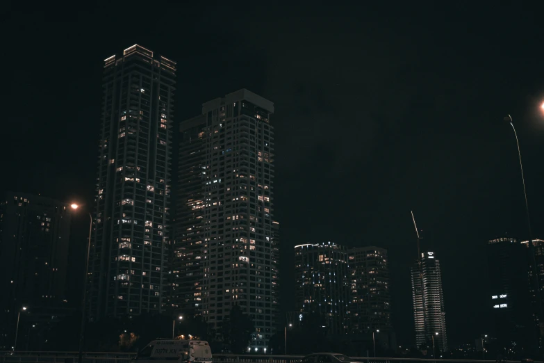 a city skyline with lots of lit up buildings at night