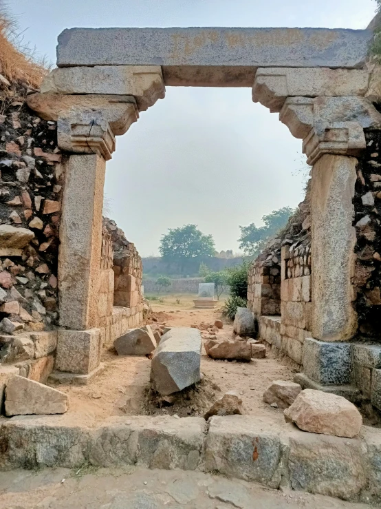 some stone buildings with many arches and rock steps