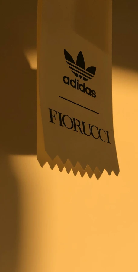a brown paper label that reads fiorucci