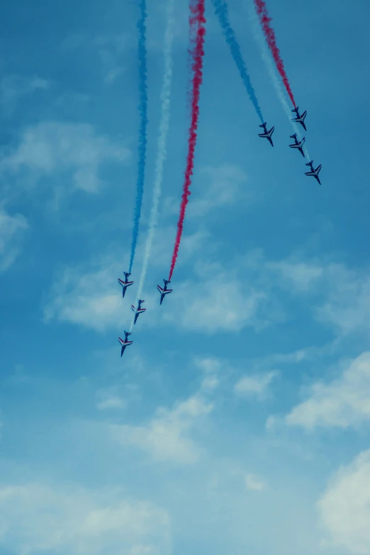 an air show flying through the air in formation