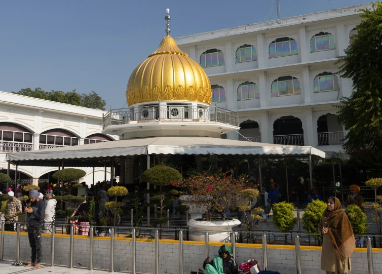 a building with a gold dome at the end of it