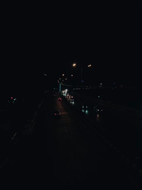 a night view of street lights, cars and freeway