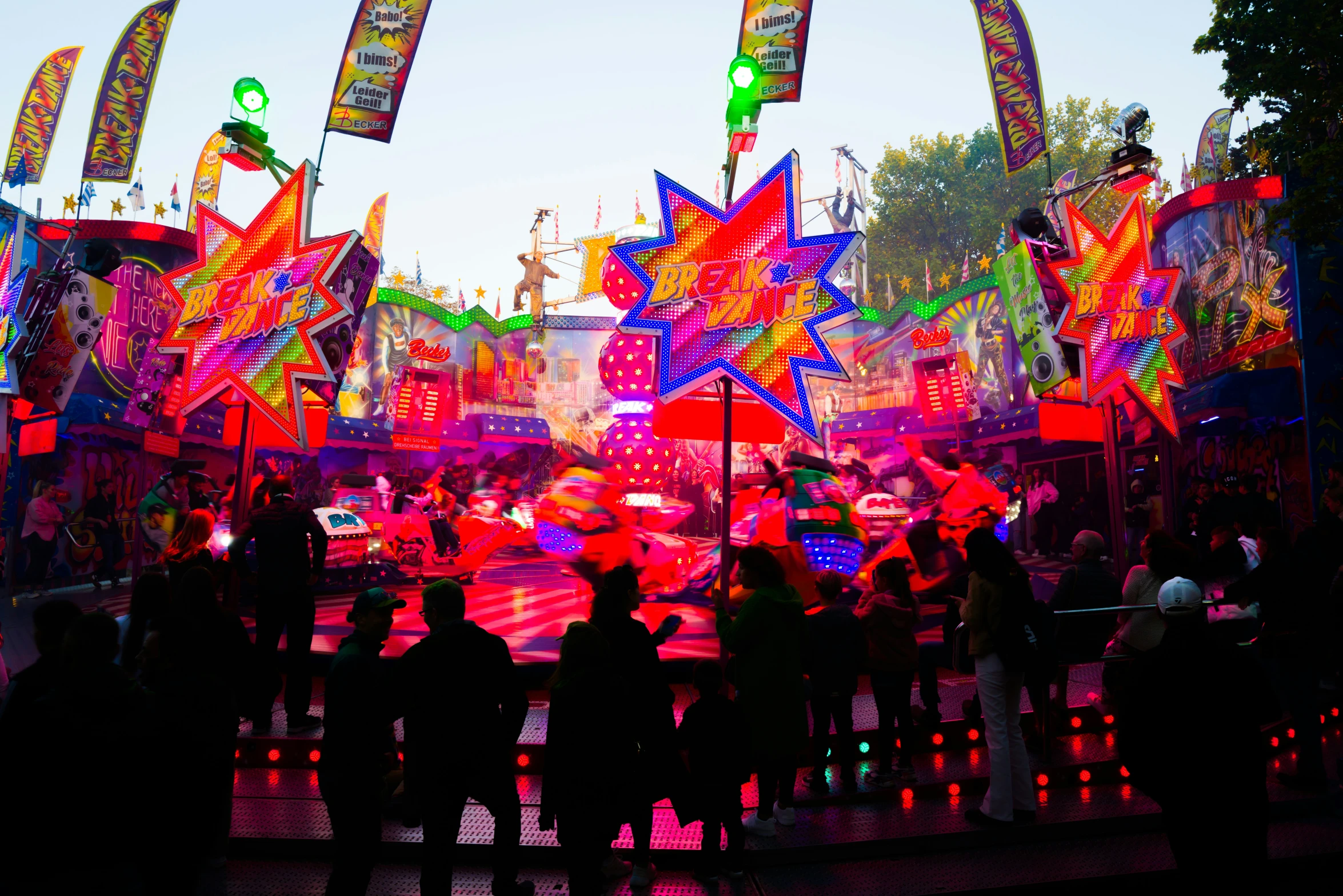 a night scene with a colorful display of umbrellas