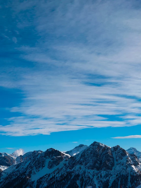 snow covered mountains under a bright blue sky