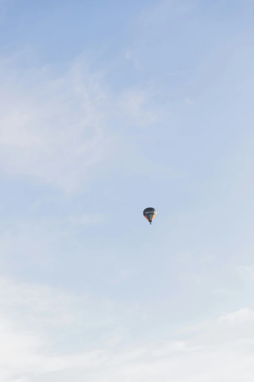 a large balloon flying high in the air