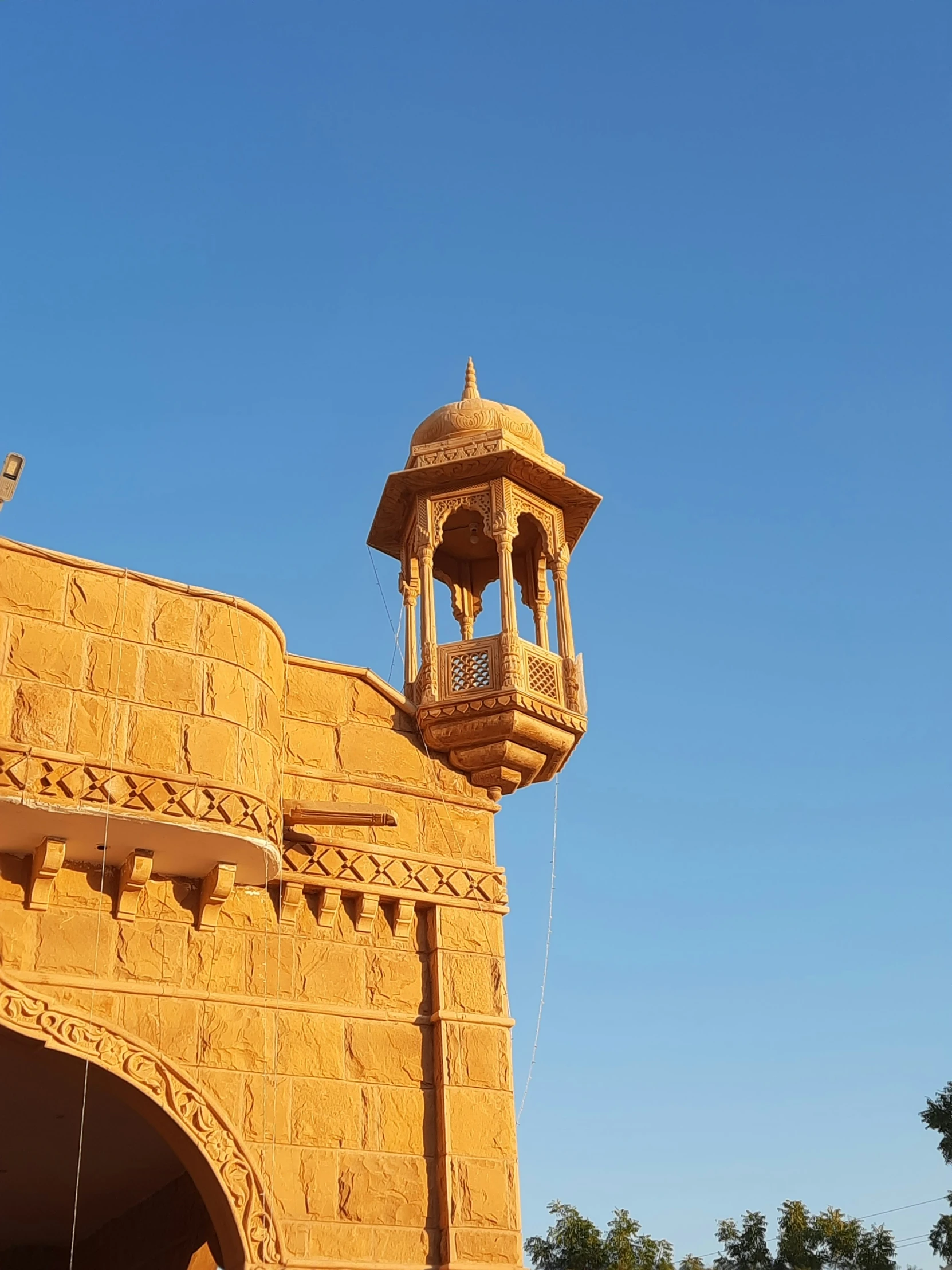 the top of a tower on a stone building