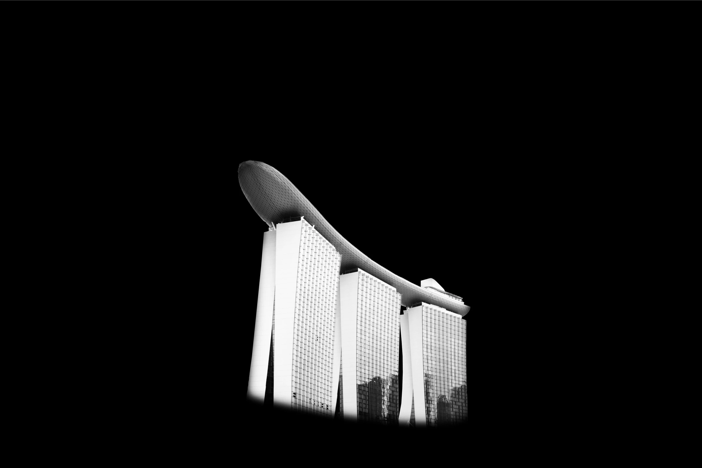 a black and white po of tall buildings against a dark background