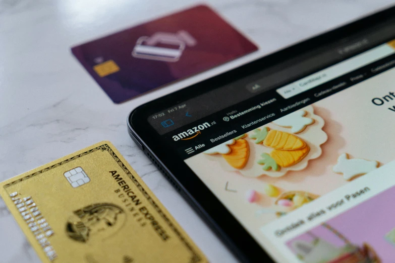 a cell phone next to some money sitting on top of a table