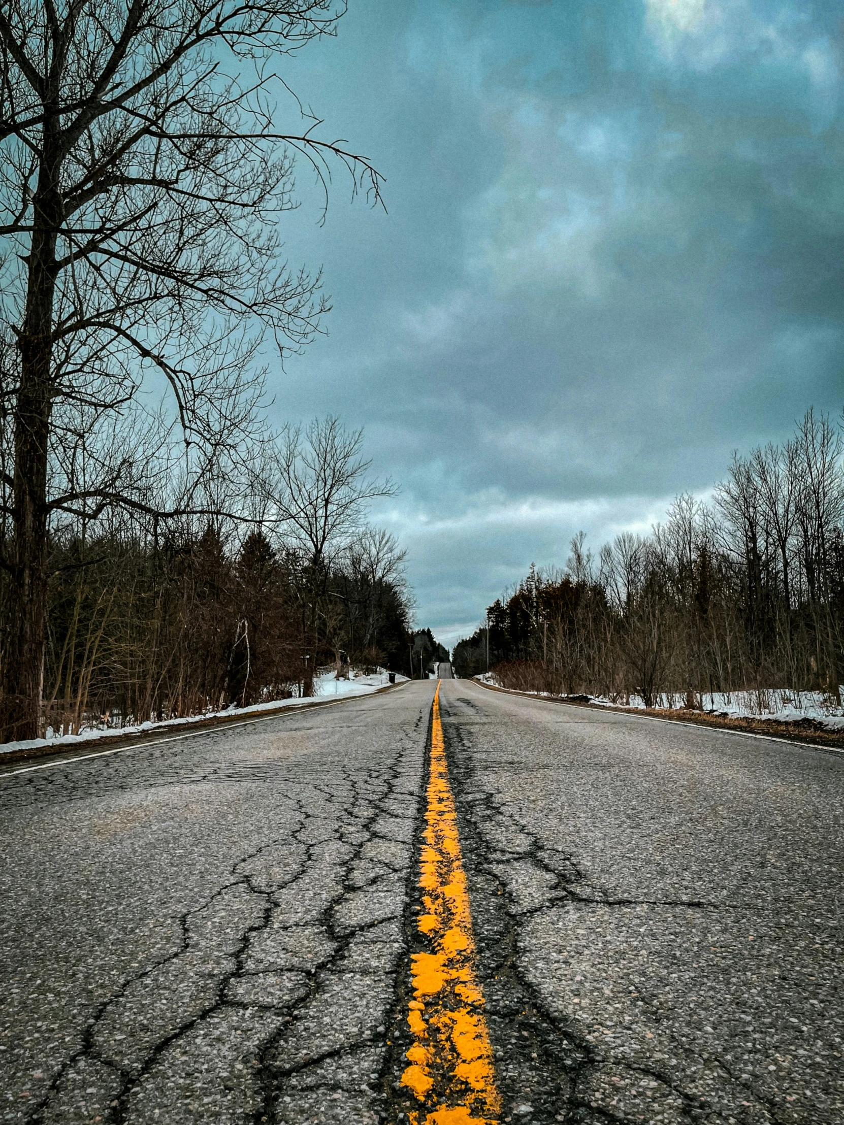 a long yellow line painted on the street in a road