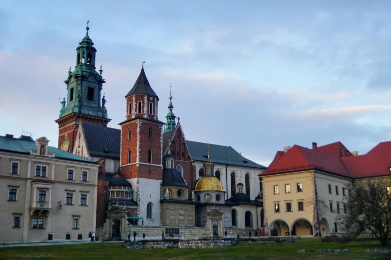 a group of old buildings with towers next to each other