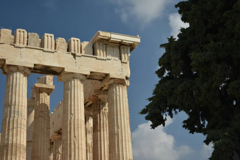 an image of a very old building with columns