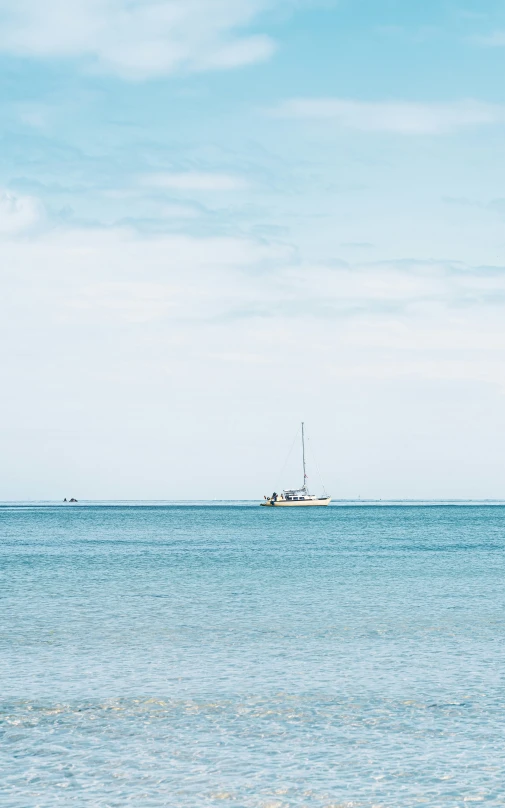 a boat is in the distance on an ocean