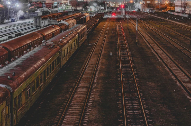 a train yard with many different trains parked in the middle of it