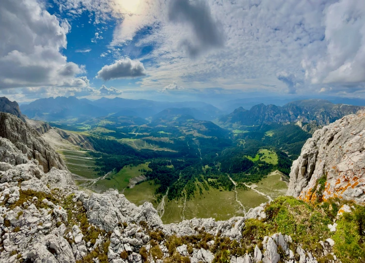 a very beautiful view with mountains and greenery