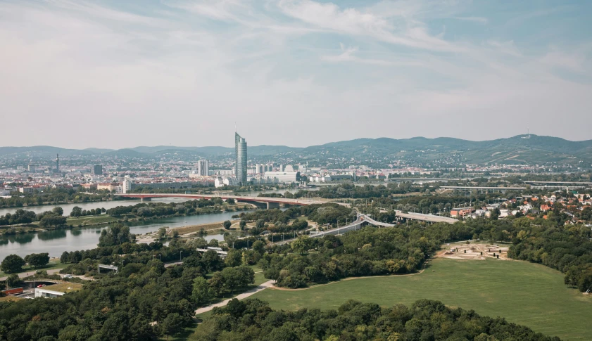 a scenic view of a city with a river running through it