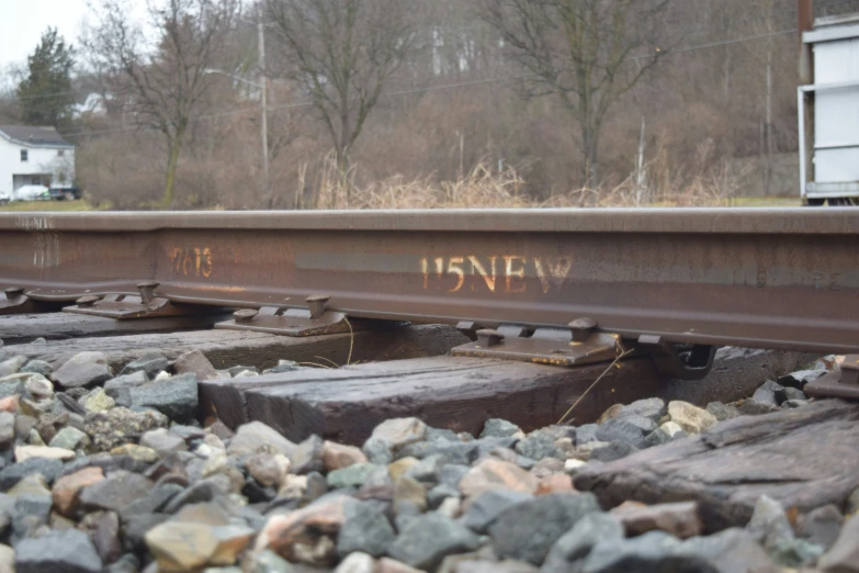 a train track with graffiti that says new