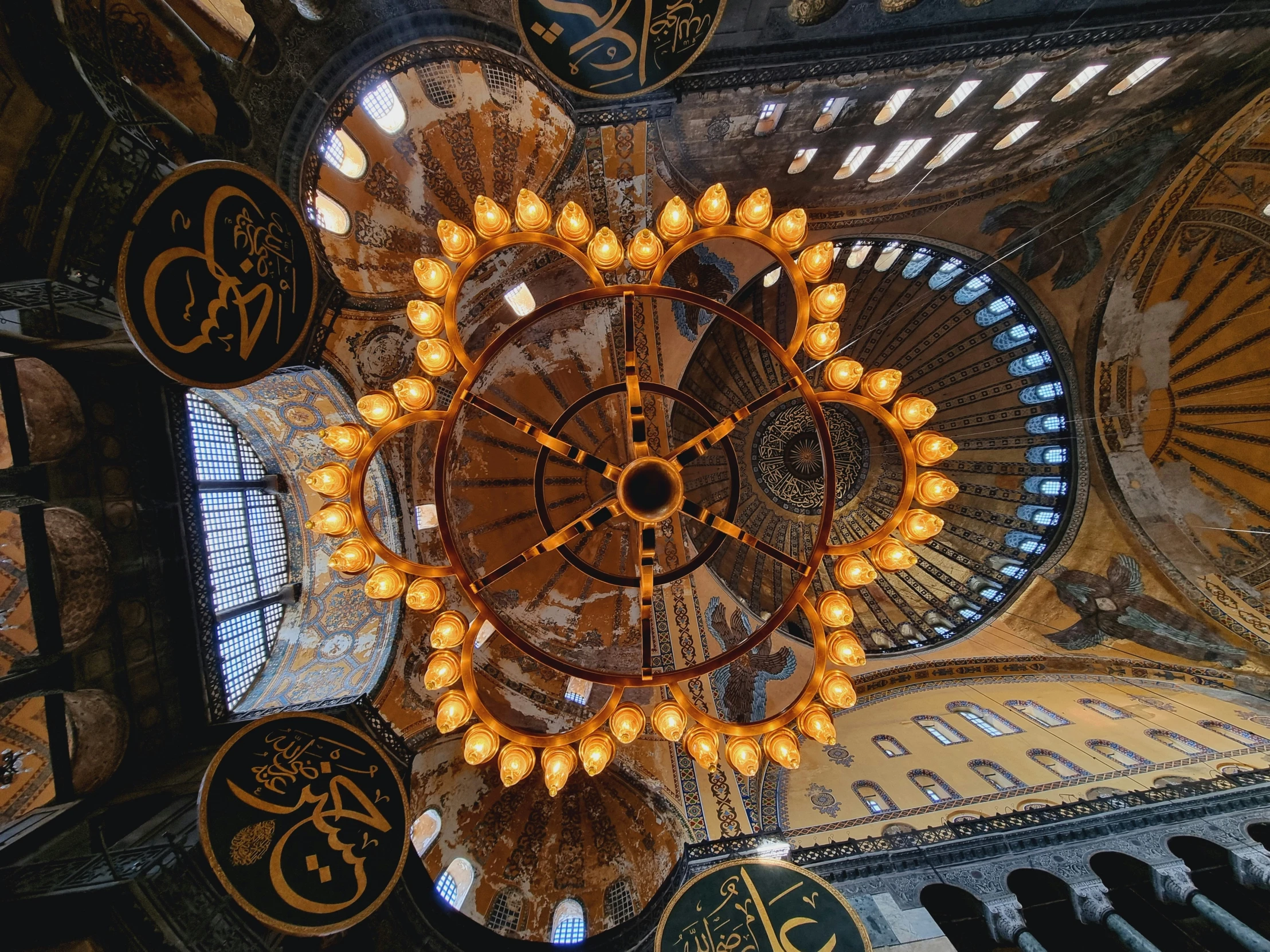 the ceiling of a building with many lights in it