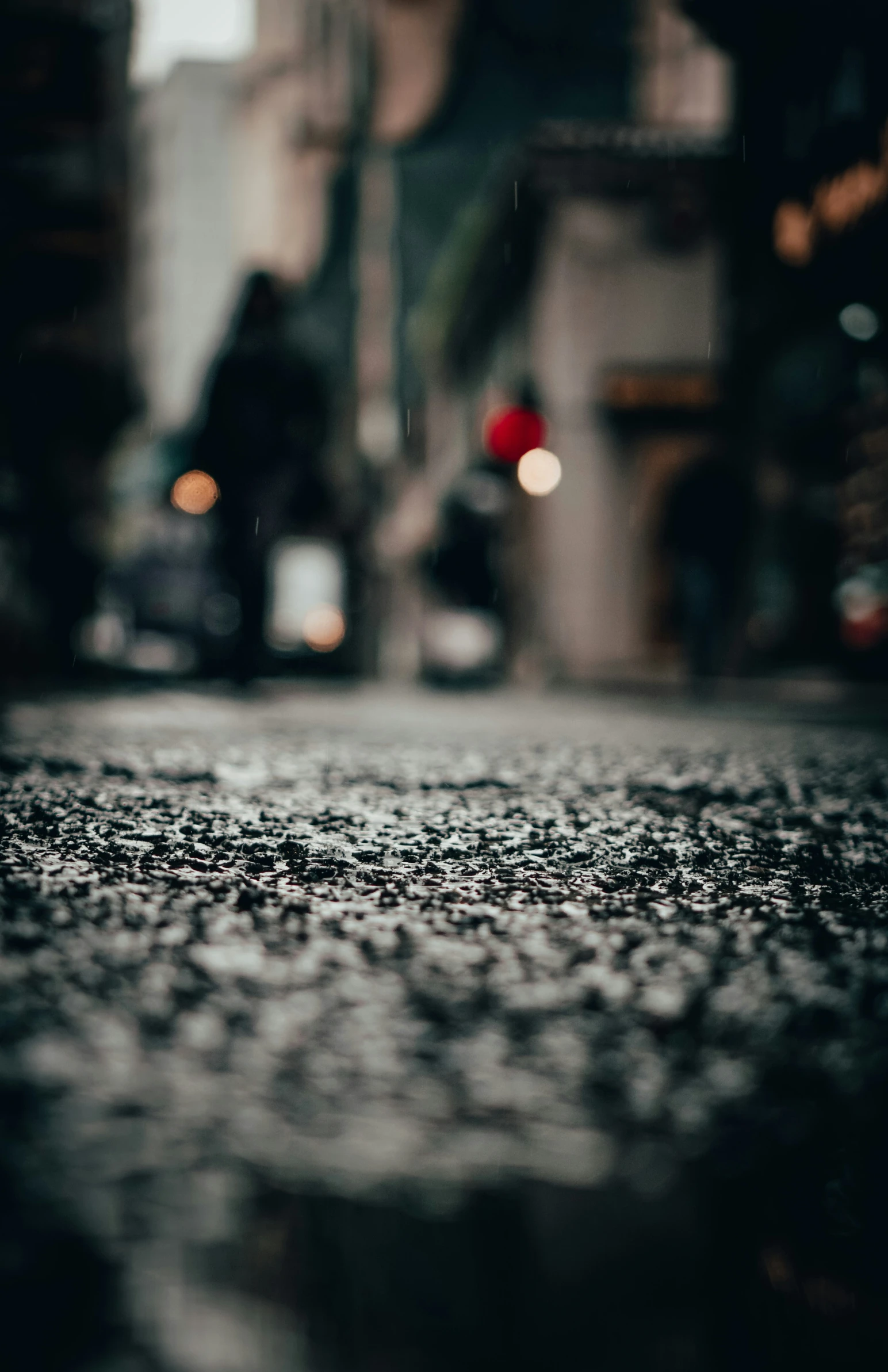 the umbrella is shining bright over the wet street