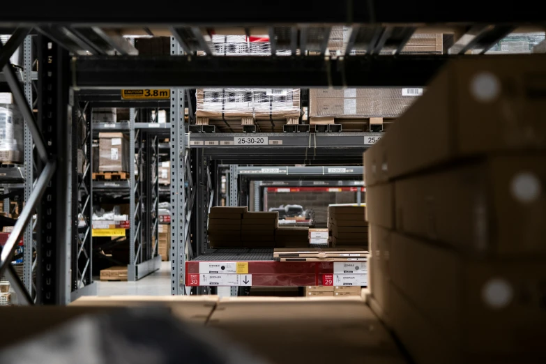 a warehouse with pallets, boxes and boxes