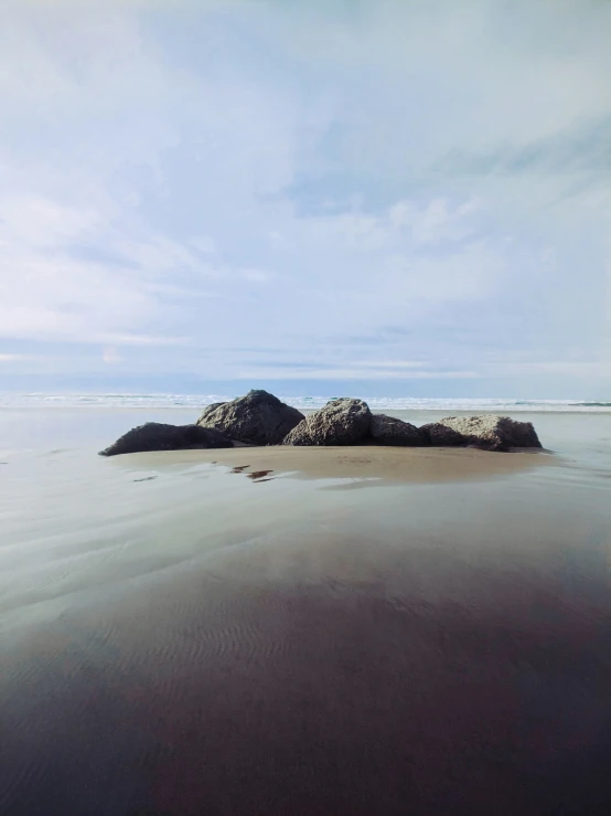 rocks in the water on the shore line