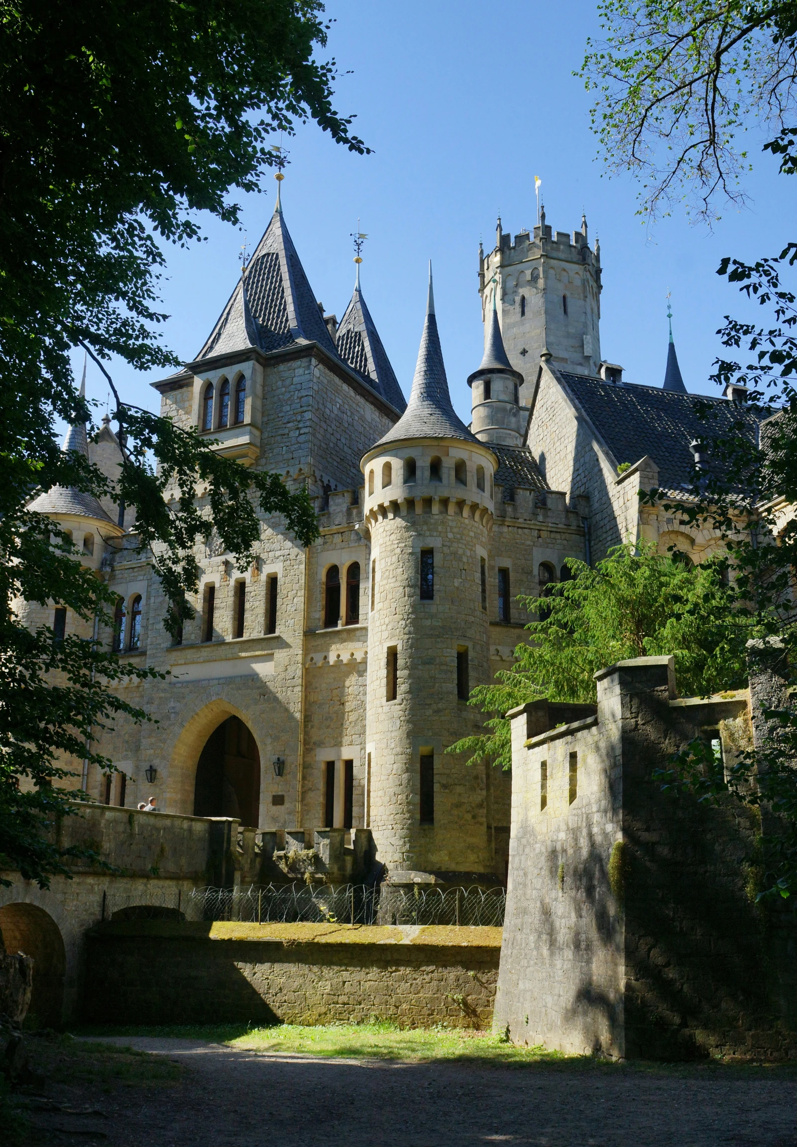 an old castle is shown on a sunny day