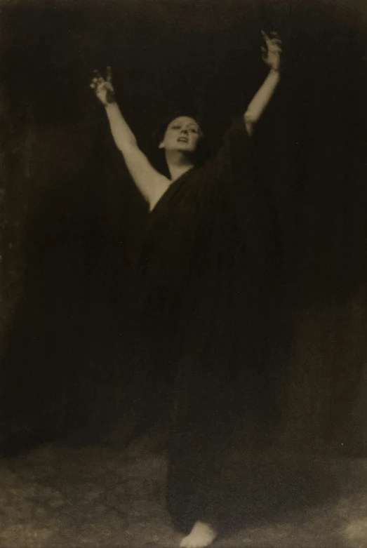 a woman is dressed in black dancing